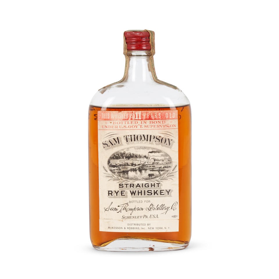 Sam Thompson Straight Rye Whiskey 11 Years Old 1921 (1 pint bottle): Sam Thompson Straight Rye Whiskey 11 Years Old 1921 (1 pint bottle) Pennsylvania official bottling, distilled fall 1921, bottled spring 1933, u: low shoulder pint 50% 1 bottle Footnotes: United States