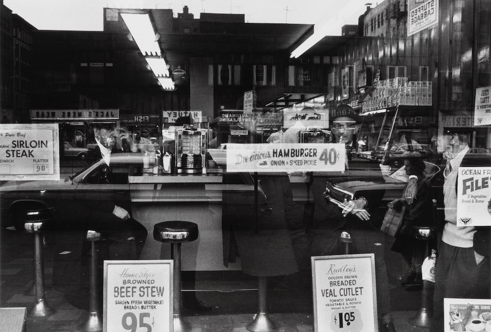 William Klein (1928-2022); 'Hamburger 40₵ New York';: William Klein (1928-2022) 'Hamburger 40₵ New York', 1955 Gelatin silver print, printed no later than 1986; signed, titled, and dated in pencil on the reverse. 11 1/8 x 17 in. (28.3 x 43.2 cm.) s
