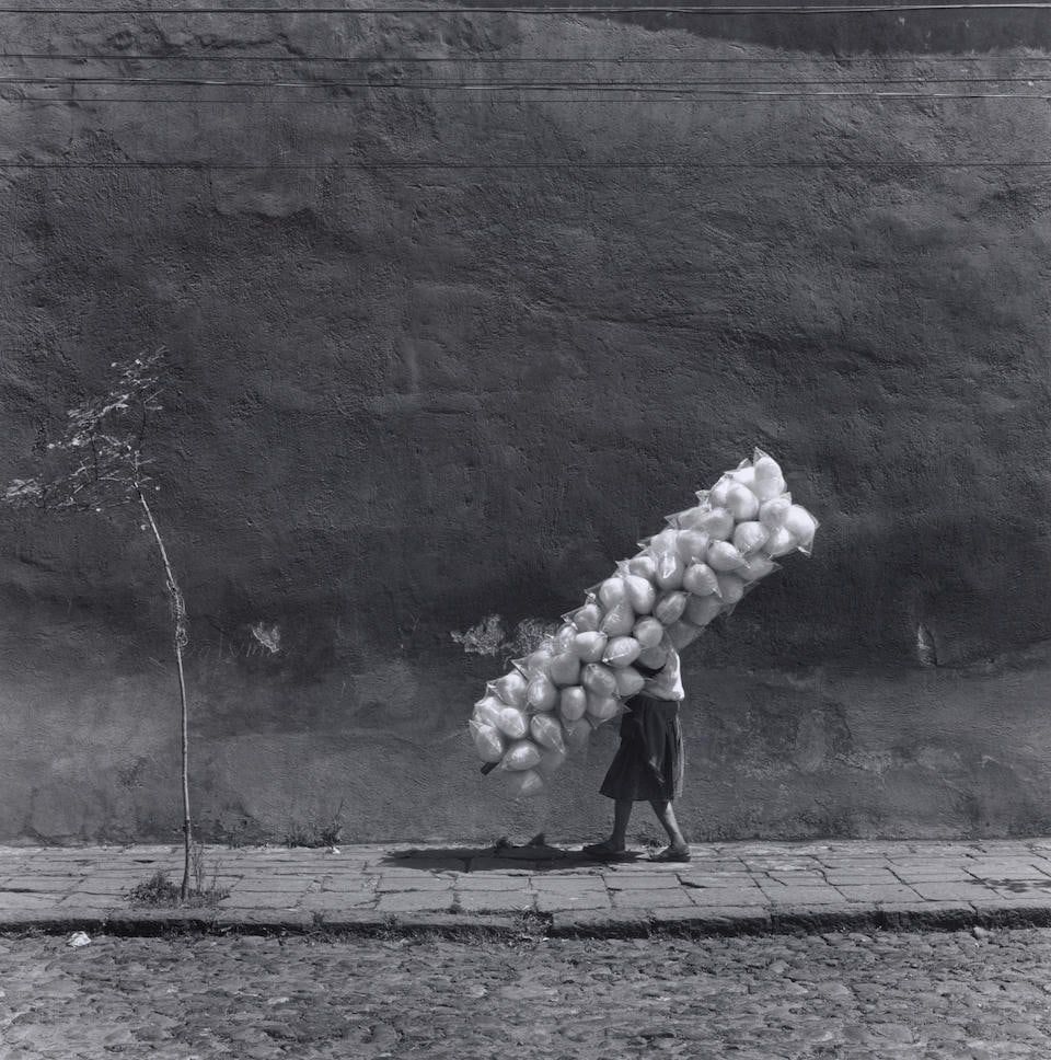 Mario Algaze (1947-2022); ''Cotton Candy', San Angel, Mexico';: Mario Algaze (1947-2022) ''Cotton Candy', San Angel, Mexico', 1981 Gelatin silver print, printed 1999; signed, titled, and dated in pencil on the reverse. 15 1/2 x 15 1/4 in. (39.4 x 38.7 cm.) sheet 2