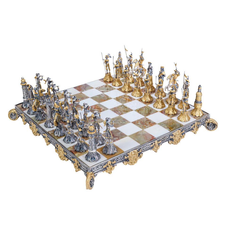 A Giuseppe Vasari French And Spanish Armies Gilt Metal And Onyx Chess