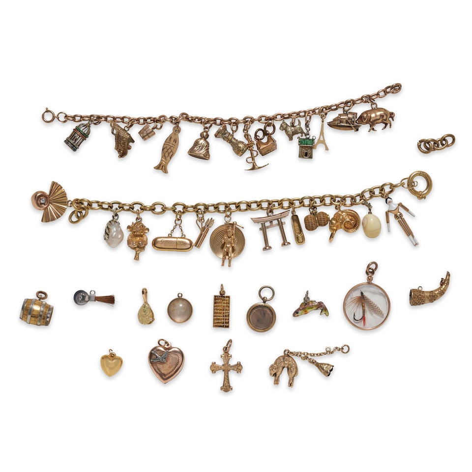 A GROUP OF CHARM BRACELETS AND CHARMS: A GROUP OF CHARM BRACELETS AND CHARMS Comprising two 14k gold bracelets suspending mostly gold charms, and a group of additional mostly gold charms, gross weight 61.4 dwt, bracelet lengths 7 3/4 and