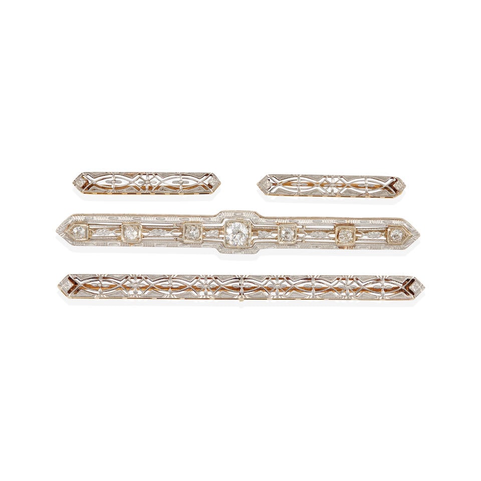 14K GOLD, PLATINUM AND DIAMOND BAR BROOCHES: 14K GOLD, PLATINUM AND DIAMOND BAR BROOCHES • One bar brooch of platinum topped 14k white gold with 7 old mine cut diamonds weighing approximately 0.80 carat total, length 2 ½ in. • O
