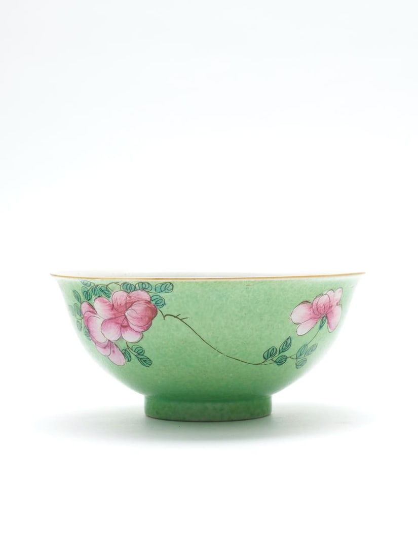 A sgraffito green-ground famille rose 'floral' bowl Qianlong six-character mark, 18th century: A sgraffito green-ground famille rose 'floral' bowl Qianlong six-character mark, 18th century bearing 'The British Antique Dealers Association' label to the base 17.8cm diam., 8.0cm high Footnotes: &#