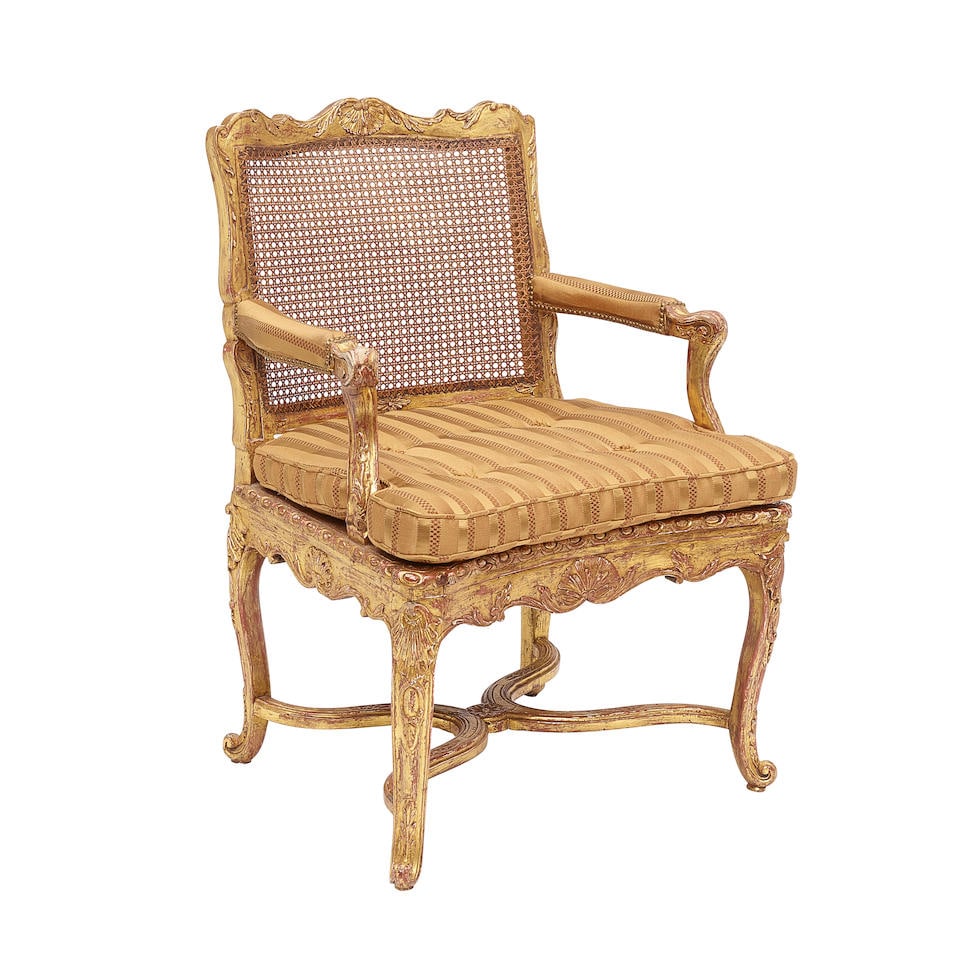 A VENETIAN STYLE CARVED GILTWOOD AND CANNED ARMCHAIR (1 of 1)