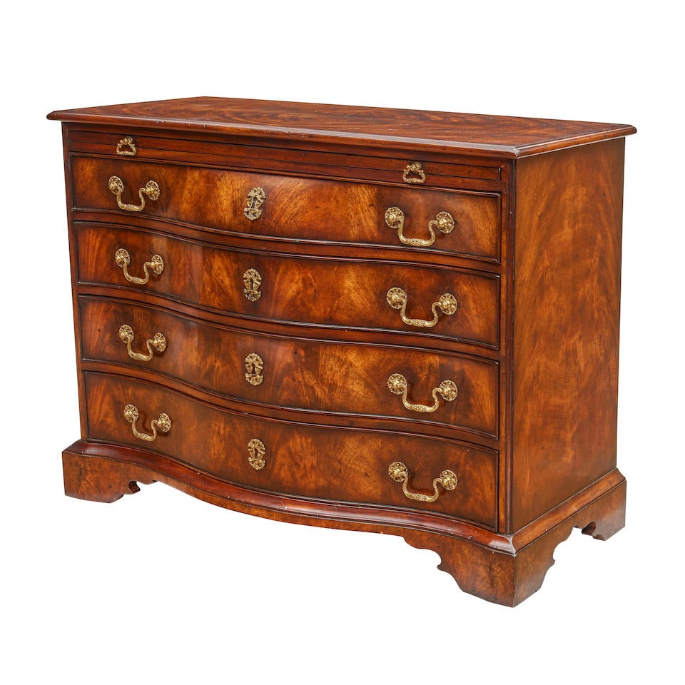 A GEORGIAN STYLE MAHOGANY STAINED SERPENTINE FRONT CHEST OF DRAWERS: A GEORGIAN STYLE MAHOGANY STAINED SERPENTINE FRONT CHEST OF DRAWERS height 32 1/2in (82.5cm); width 42in (106.7cm); depth 20in (50.7cm) Footnotes: From a Donna Livingston designed Wilshire penthouse. 