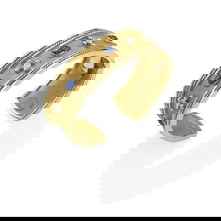 MAZ: A 14K GOLD, SAPPHIRE AND DIAMOND HINGED CUFF BRACELET: MAZ: A 14K GOLD, SAPPHIRE AND DIAMOND HINGED CUFF BRACELET Of hammered, textured and high-polish gold, featuring a central row of bezel-set cabochon sapphires weighing approximately 7.15 carats and ro