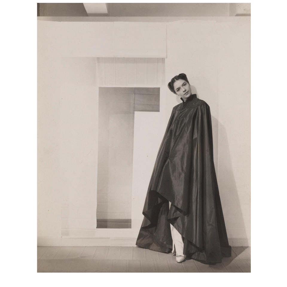 Cecil Beaton (1904-1980); Ruth Ford Wearing an Elsa Schiaparelli Design (for 'Vogue');: Cecil Beaton (1904-1980) Ruth Ford Wearing an Elsa Schiaparelli Design (for 'Vogue'), c. 1935 Gelatin silver print; with annotations in red ink on the reverse. 9 5/8 x 7 3/4 in. (24.4 x 19.7 cm.) shee