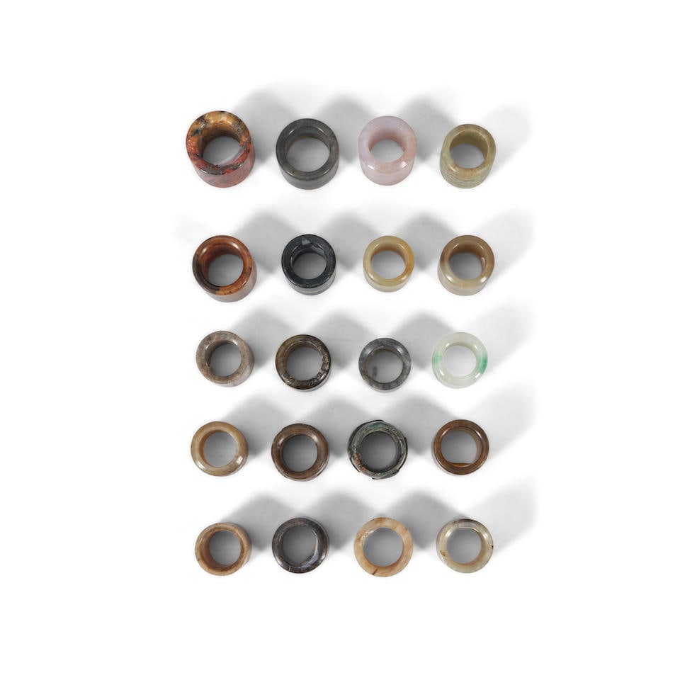 TWENTY HARDSTONE AND JADEITE ARCHER'S RINGS 20th century (20) (1 of 2)
