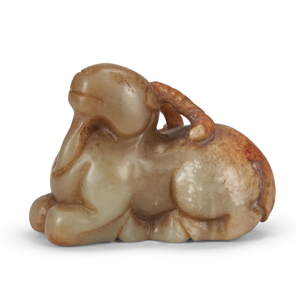 A CELADON AND RUSSET JADE RAM 20th century (1 of 2)