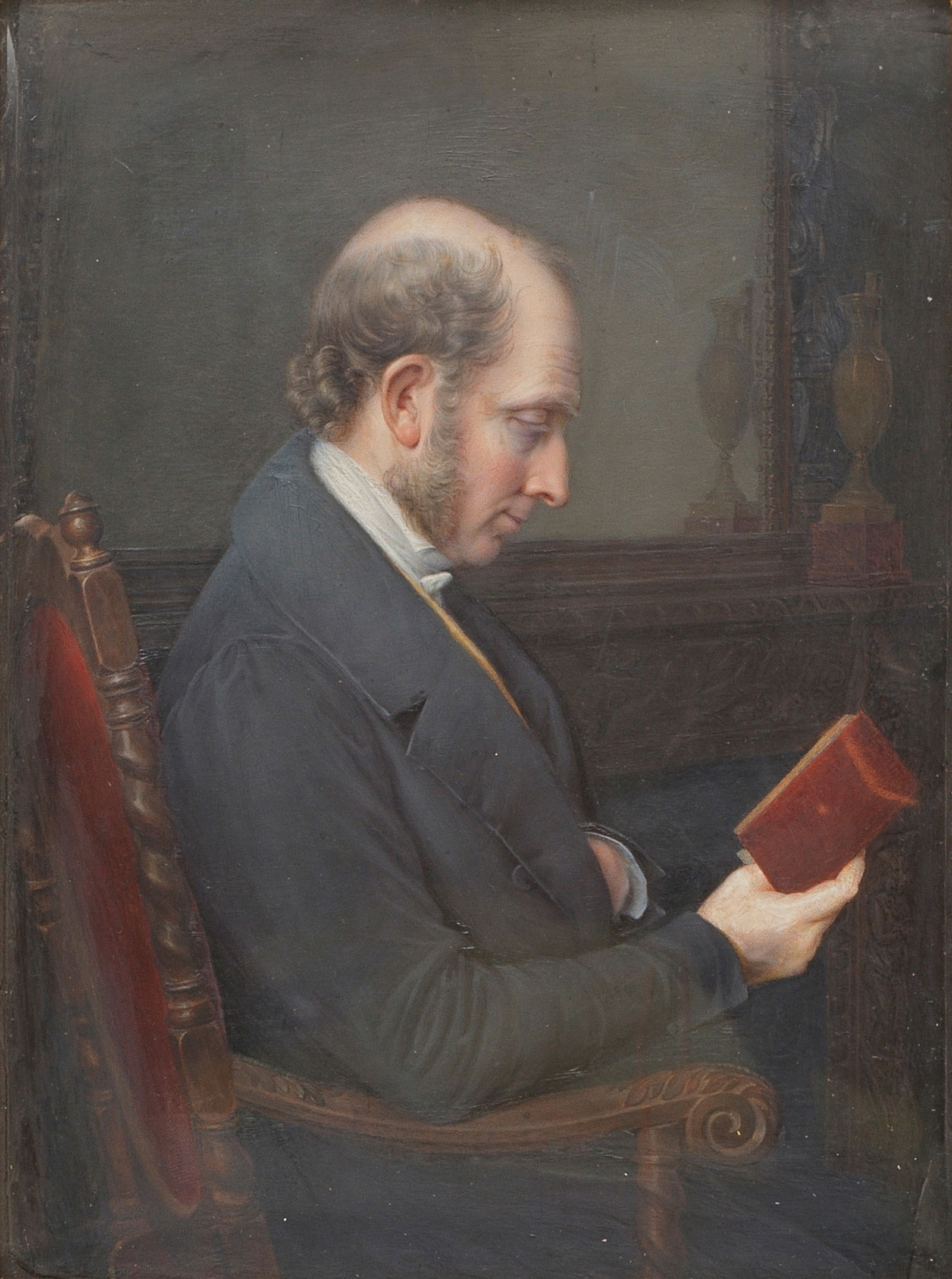 Pauline Augustin (French, 1781-1865) A Gentleman, a member of the Drucruet family, seated half-l...: Pauline Augustin (French, 1781-1865) A Gentleman, a member of the Drucruet family, seated half-length in profile reading a book, wearing a black coat, buff waistcoat and a white shirt, receding grizzl