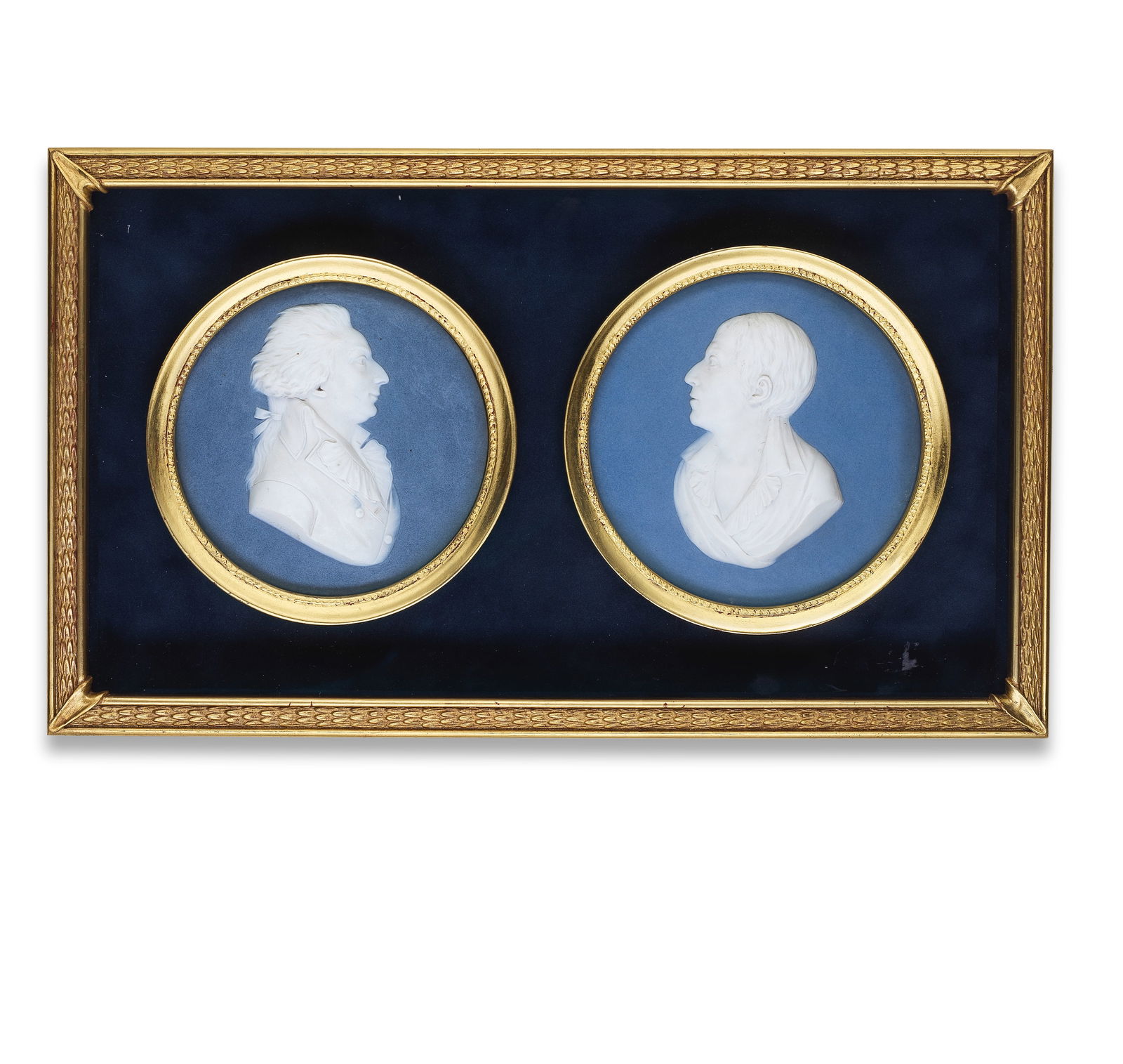 Two large Sèvres porcelain biscuit portrait medallions, circa 1800: Two large Sèvres porcelain biscuit portrait medallions, circa 1800 Facing sinister likely Denis Diderot, each set against a blue biscuit ground, set in later circular wooden frames and again in a