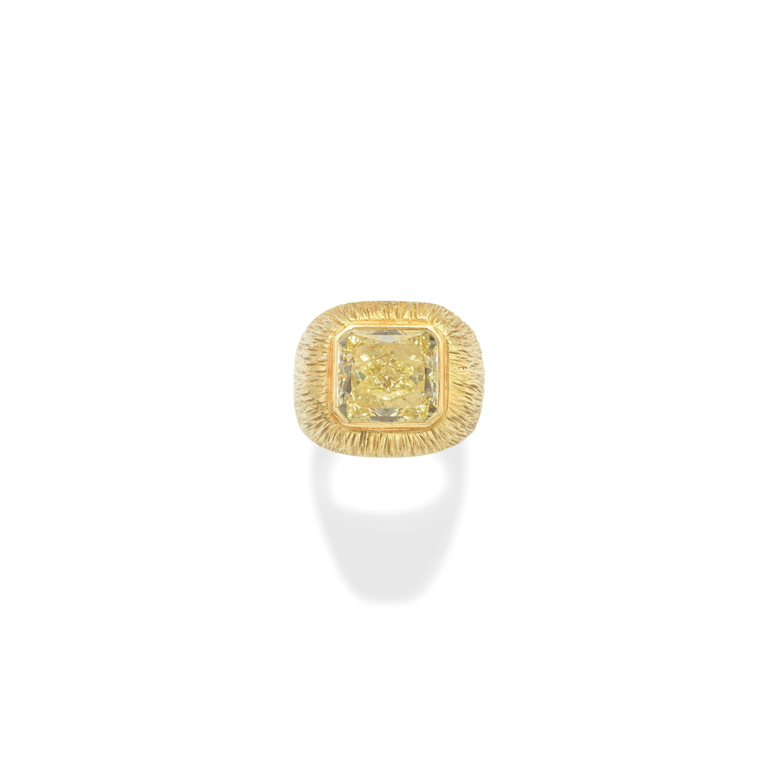 GRIMA: COLOURED DIAMOND RING, CIRCA 1995: GRIMA: COLOURED DIAMOND RING, CIRCA 1995 The radiant-cut Fancy Yellow diamond, weighing 6.30 carats, within a textured mount of bombé form, signed Grima, ring size G½ Footnotes: Lots 110 -