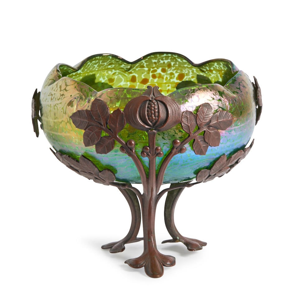 LOETZ IRIDESCENT GLASS AND METAL MOUNTED BOWL Czech Republic, c. 1900, unmarked, ht. 7 1/8, dia....: LOETZ IRIDESCENT GLASS AND METAL MOUNTED BOWL Czech Republic, c. 1900, unmarked, ht. 7 1/8, dia. 8 in. For further information on this lot please visit Bonhams.com For further information about this l