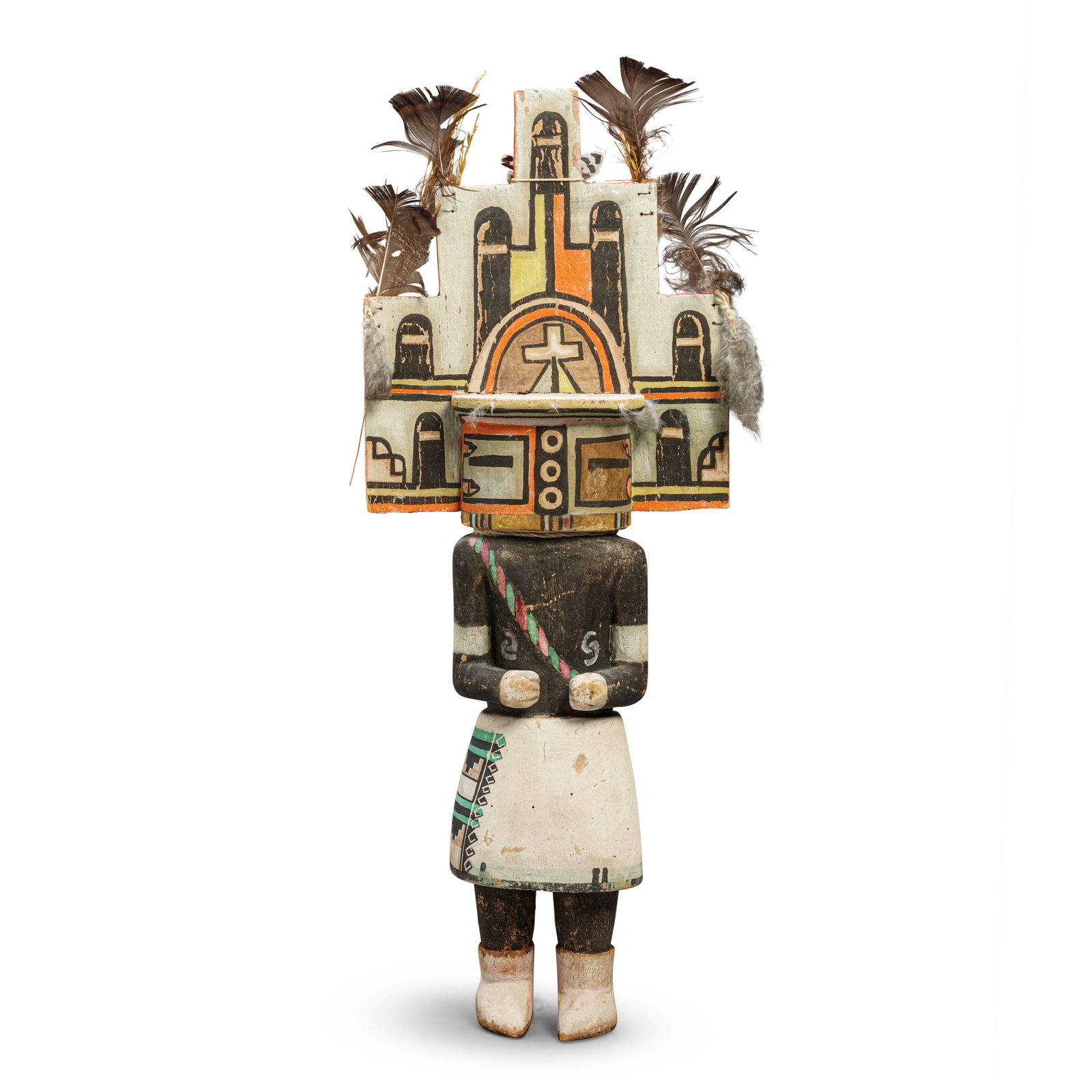 A Hopi katsina figure, depicting Hemis: A Hopi katsina figure Of carved and painted cottonwood, depicting Hemis, with characteristic body paint, painted sash and face, the head surmounted head surmounted by a large stepped tableta decorated