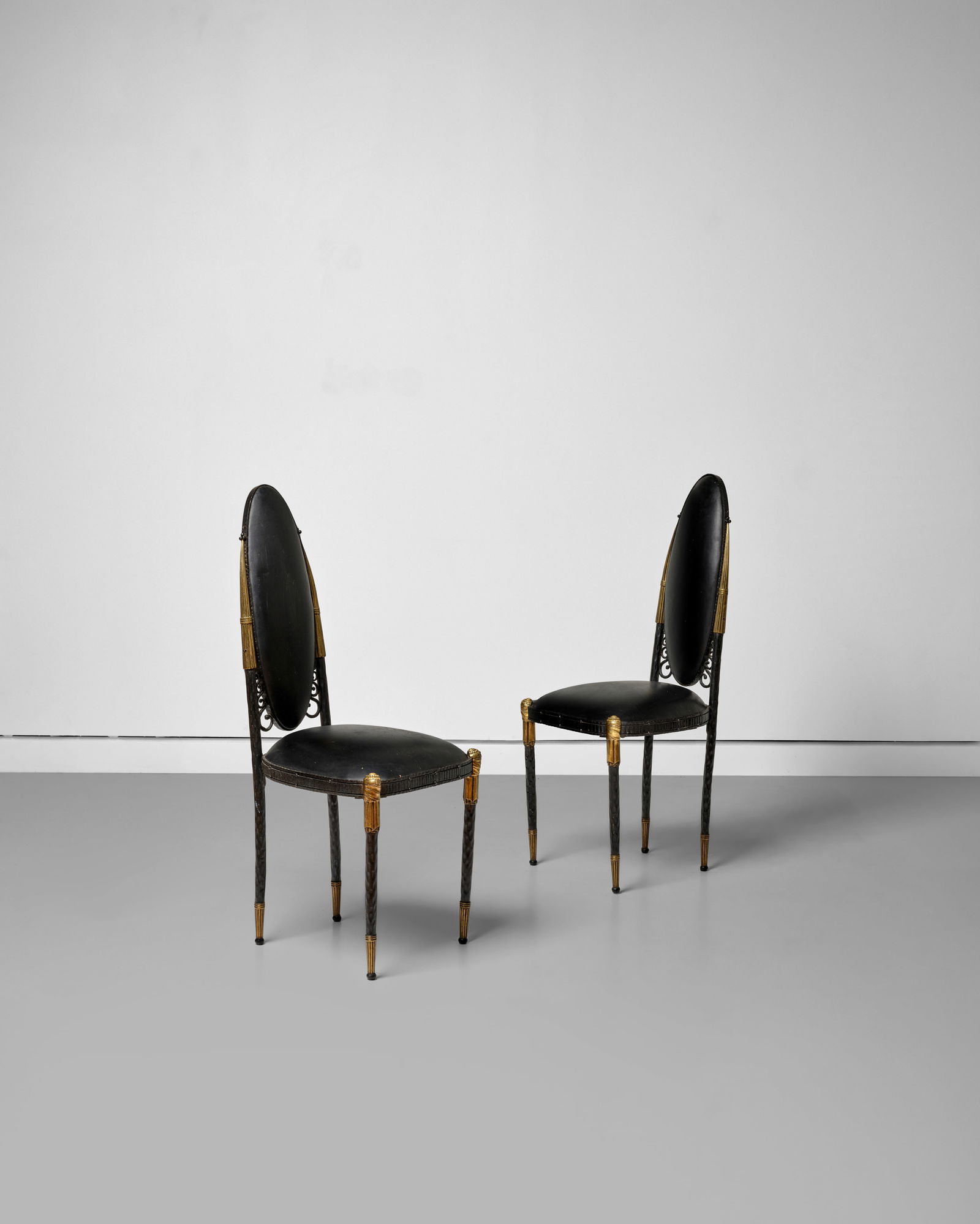 RAYMOND SUBES (1893-1970); ATTRIBUTED TO Pair of Side Chairscirca 1925leather, painted and gilt ...: RAYMOND SUBES (1893-1970); ATTRIBUTED TO Pair of Side Chairs circa 1925 leather, painted and gilt metal, with paper labels to the underside of the seat height 39in (99cm); width 15 3/4in (40cm); 16 1/