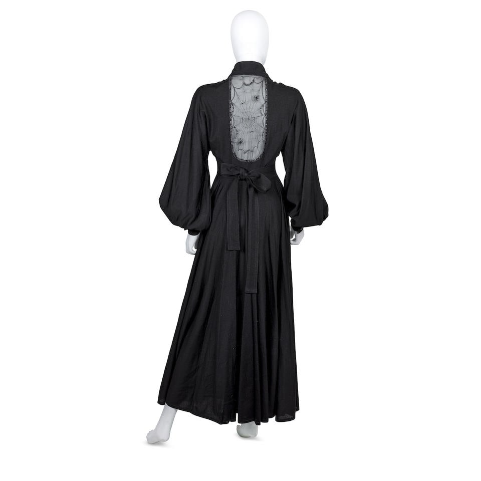 Jean Varon (1938-2022) Cobweb Spider Dress, circa 1973: Jean Varon (1938-2022) Cobweb Spider Dress, circa 1973 Black jersey with embroidered/appliqué tulle panel of web and spider to the reverse Labelled size 12, approximate measurements: 36' chest, 2