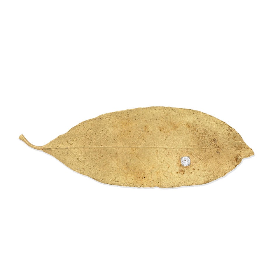 GRIMA: DIAMOND-SET LEAF BROOCH,: GRIMA: DIAMOND-SET LEAF BROOCH, 1972 Brilliant-cut diamond, approx. 0.10ct 18 carat gold Signed GRIMA, maker's mark AGLtd, London hallmark Length 7.5cm Weight approx. 9.5g Footnotes: OVERALL CONDITION