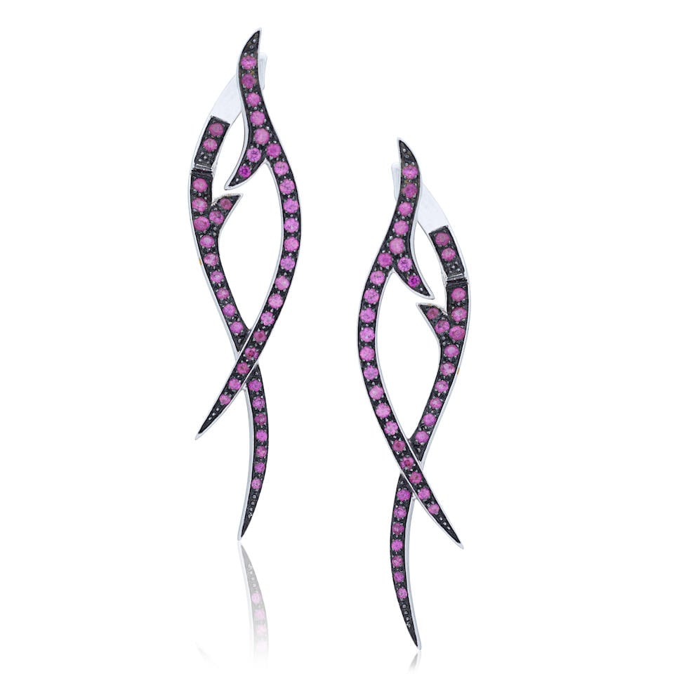 STEPHEN WEBSTER: 'STEM DROP' EARRINGS: STEPHEN WEBSTER: 'STEM DROP' EARRINGS Circular-cut purple sapphires, untested 18 carat white gold Signed SW, maker's mark, London hallmark Length 4.9cm Total weight approx. 6.5g Maker's case Footnotes