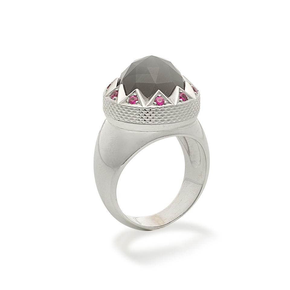 STEPHEN WEBSTER: MOONSTONE AND PINK SAPPHIRE RING: STEPHEN WEBSTER: MOONSTONE AND PINK SAPPHIRE RING Mixed-cut moonstone Circular-cut pink sapphires 18 carat white gold Maker's mark SW, London hallmark Ring size approx. K Weight approx. 16.5g Maker's