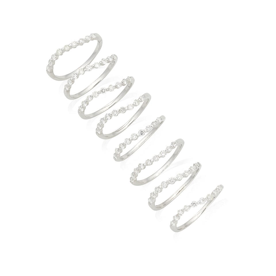 DIAMOND STACKABLE RINGS (8): DIAMOND STACKABLE RINGS Brilliant-cut diamonds, approx. 2.15cts total Ring size approx. O Total weight approx. 12.0g (8) Footnotes: OVERALL CONDITION Light surface wear to the unhallmarked metal (hoop