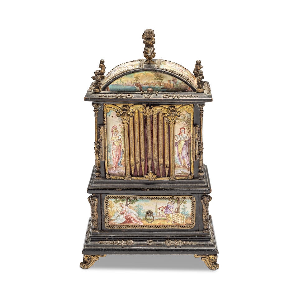 A late 19th century gilt bronze mounted and Viennese enamel inset ebonised miniature musical jew...: A late 19th century gilt bronze mounted and Viennese enamel inset ebonised miniature musical jewellery casket Formed as a floor standing pipe organ, the arched pediment surmounted by a seated winged p