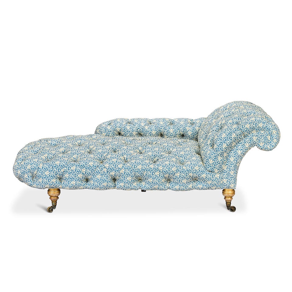 A late Victorian giltwood daybed or chaise longue by Howard and Sons 1875-1890: A late Victorian giltwood daybed or chaise longue by Howard and Sons 1875-1890 With one outscrolled end, on ring turned baluster legs terminating in ring turned brass cappings and castors, the undersi