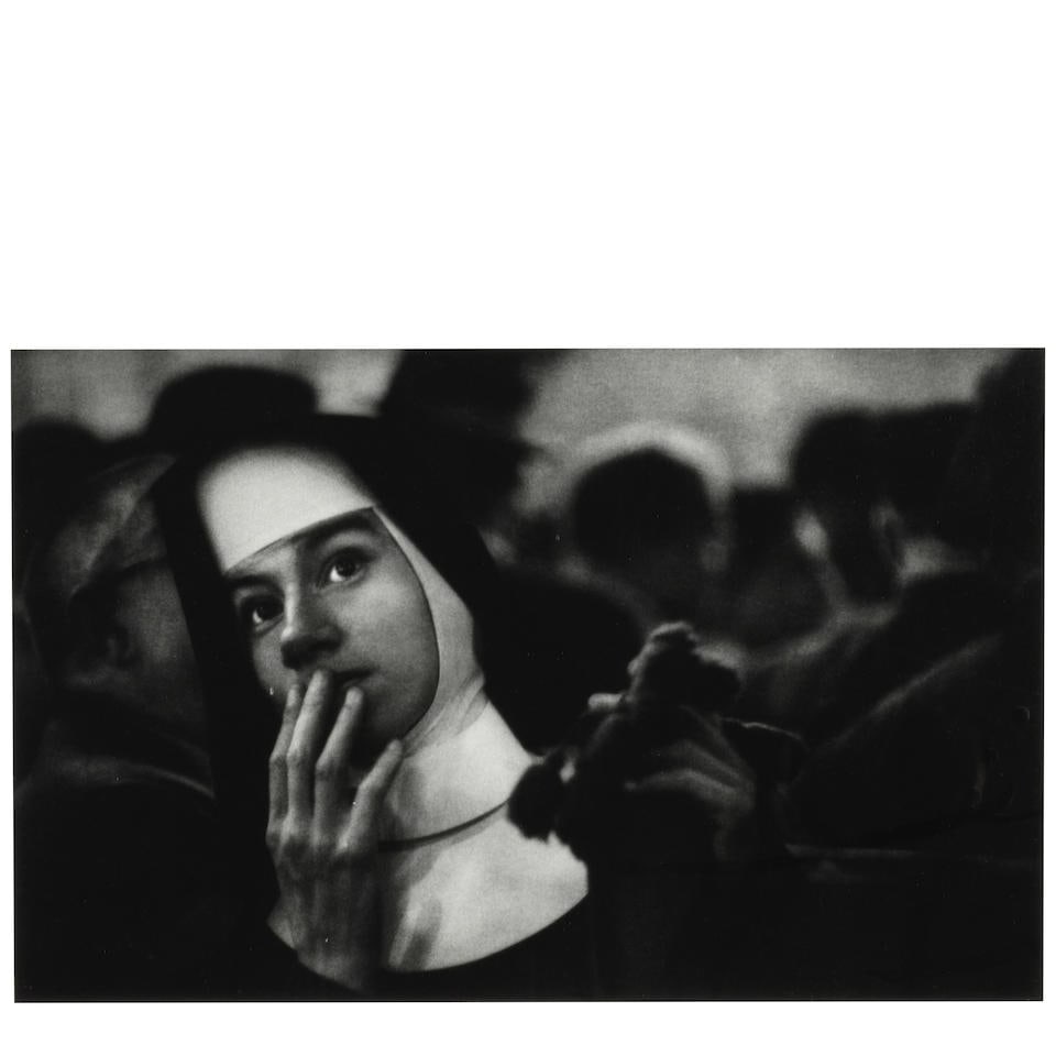 W. Eugene Smith (1918-1978); A Nun Waiting for Survivors: The Andrea Doria Sinking;: W. Eugene Smith (1918-1978) A Nun Waiting for Survivors: The Andrea Doria Sinking, 1956 Gelatin silver print, printed before 1978; the photographer's estate stamp on the reverse, framed. 6 1/4 x 10 in