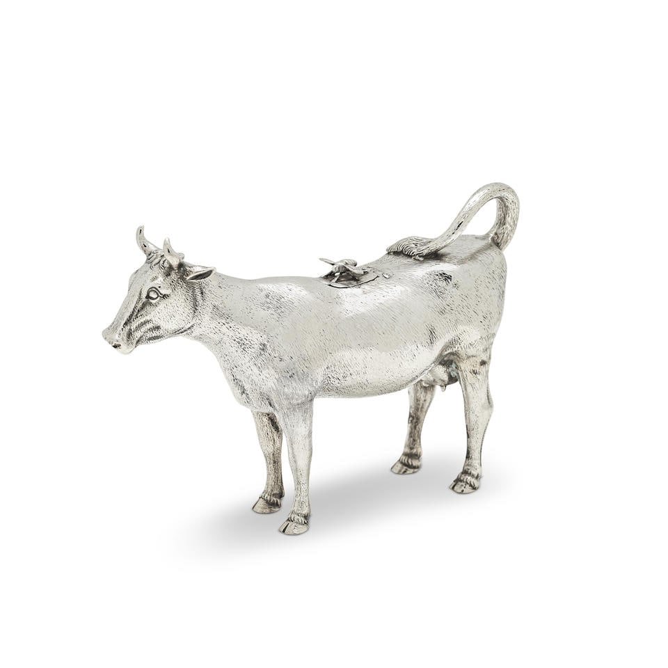 A fine Victorian silver cow creamer George Fox, London 1875: A fine Victorian silver cow creamer George Fox, London 1875 Naturalistically modelled as a standing cow, with hair effect chasing, the hinged cover with applied fly finial, height 11.5cm, length 16cm,