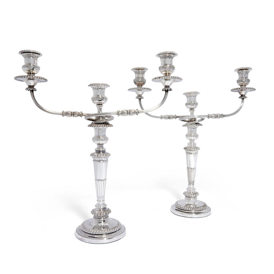 A pair of George III silver three-light candelabra Smith Tate & Co (George Smith, Robert Tate, ...: A pair of George III silver three-light candelabra Smith Tate & Co (George Smith, Robert Tate, William Nicholson & Ewin Hoult), Sheffield 1816 The detachable branch sections with two reeded scroll arm