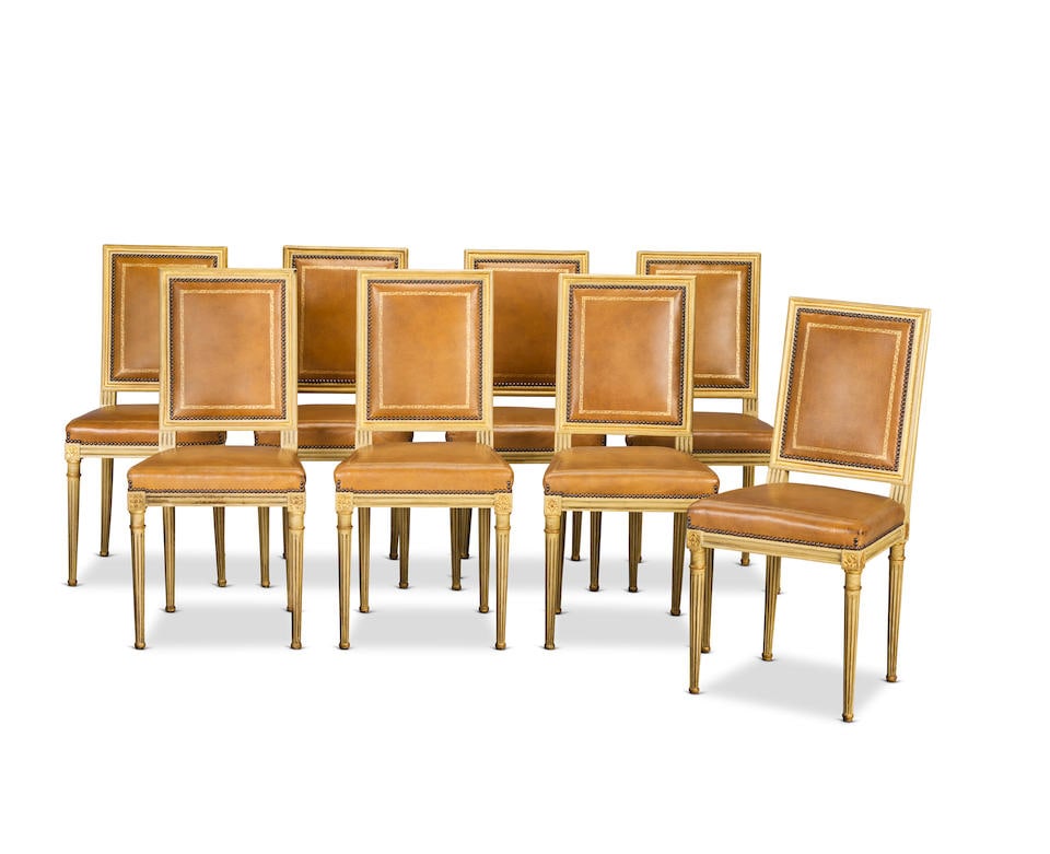 A matched set of eight painted and parcel gilt side chairs or chaises At least four chairs datin...: A matched set of eight painted and parcel gilt side chairs or chaises At least four chairs dating to the Louis XVI period (circa 1790), the others made to match and of a later date Each with a channel
