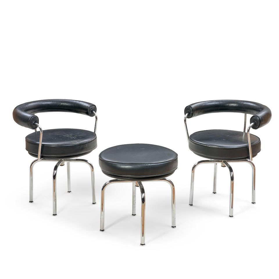 TWO CHARLOTTE PERRIAND, PIERRE JEANNERET, AND LE CORBUSIER FOR CASSINA 'FAUTEUIL TOURNANT' AND A...: TWO CHARLOTTE PERRIAND, PIERRE JEANNERET, AND LE CORBUSIER FOR CASSINA 'FAUTEUIL TOURNANT' AND A 'TABOURET TOURNANT' designed 1927, later production, leather, chromed steel, chairs with manufacturer's