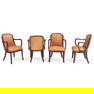 FOUR DONGHIA 'CORONIA' ARMCHAIRS United States, c. 1980, leather, lacquered mahogany, maker's fa...