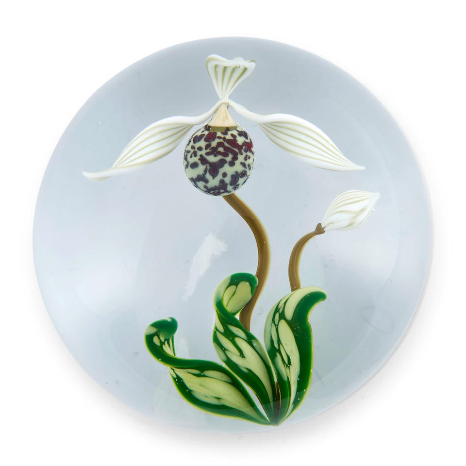 GORDON SMITH (B. 1959) PAPHIOPEDILUM ORCHID GLASS PAPERWEIGHT New Jersey, dated 1989, incised ma...: GORDON SMITH (B. 1959) PAPHIOPEDILUM ORCHID GLASS PAPERWEIGHT New Jersey, dated 1989, incised mark 'GES 1989,' ht. 2, dia. 2 7/8 in. For further information on this lot please visit Bonhams.com For fu