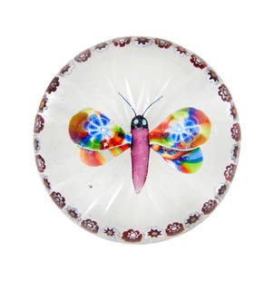 A Baccarat garlanded butterfly paperweight, circa 1850: A Baccarat garlanded butterfly paperweight, circa 1850 The colourful insect with mosaic and marbled wings, a purple latticinio thorax, darker head and antennae, and turquoise eyes, all within a garlan