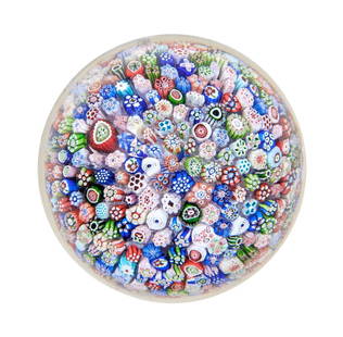 A Baccarat closepack millefiori paperweight, dated 1847: A Baccarat closepack millefiori paperweight, dated 1847 The tight arrangement of assorted brightly coloured canes including Gridel silhouettes of a pigeon and six flowers, signed and dated with the ca