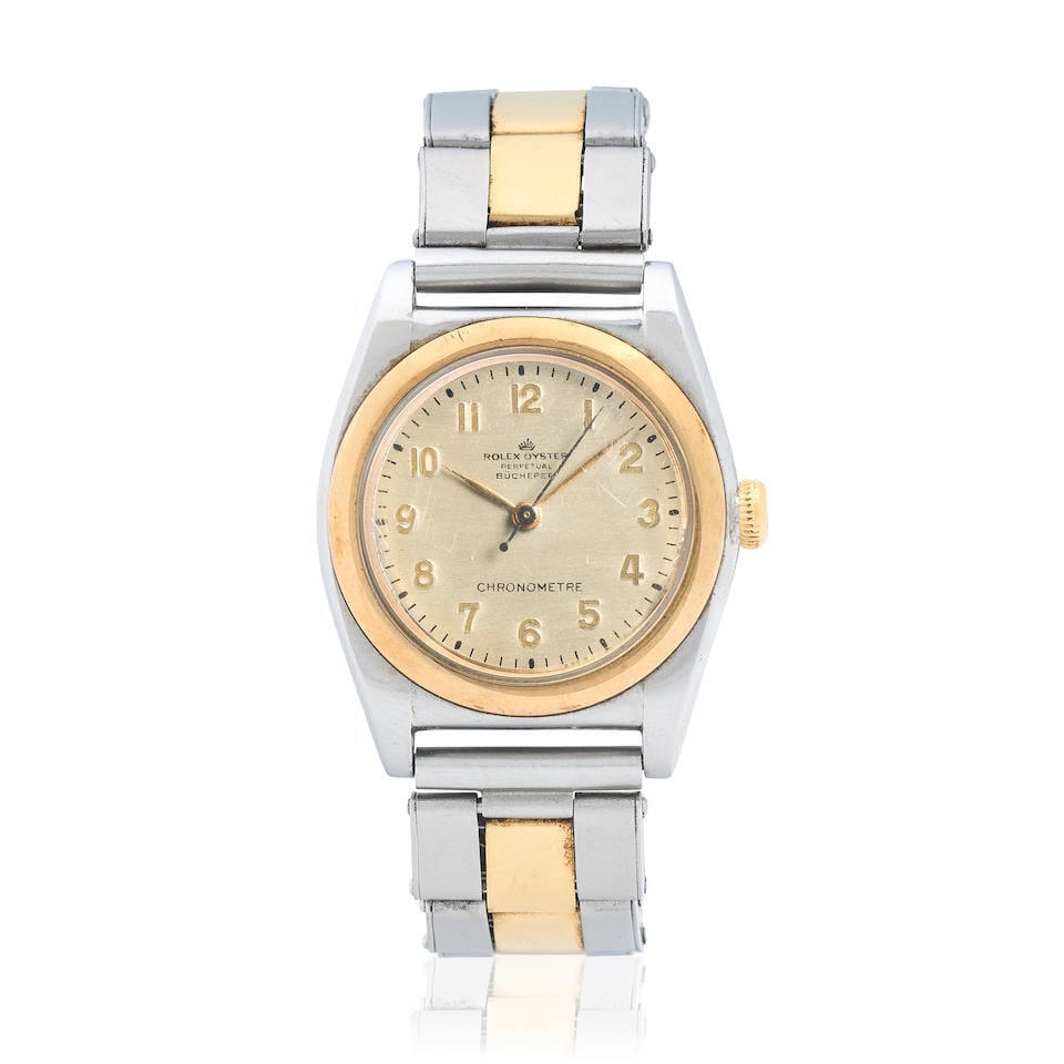 Rolex. A stainless steel and gold automatic bubbleback bracelet watch retailed by Bucherer Oyst...: Rolex. A stainless steel and gold automatic bubbleback bracelet watch retailed by Bucherer Model: Oyster Perpetual Reference: 3133 Date: Circa 1946 Movement: Jewelled automatic, No.15082 Dial: Silvere