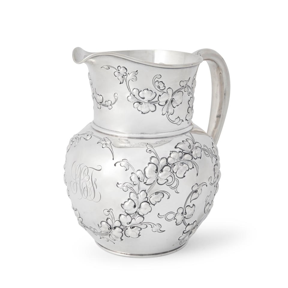Davis & Galt Sterling Silver Water Pitcher,: Davis & Galt Sterling Silver Water Pitcher, Philadelphia, circa 1900, retailed by Galt & Bro., of standard form with repousse foliate decorations, monogrammed to center and dated to the underside, ht.