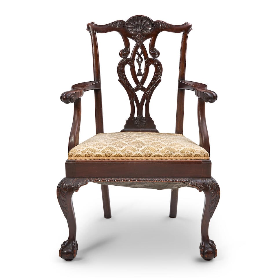 George III-style Mahogany Arm Chair,: George III-style Mahogany Arm Chair, in the style of Thomas Chippendale, ht. 39 1/2, wd. 26, dp. 19 in. For further information on this lot please visit Bonhams.com For further information about this