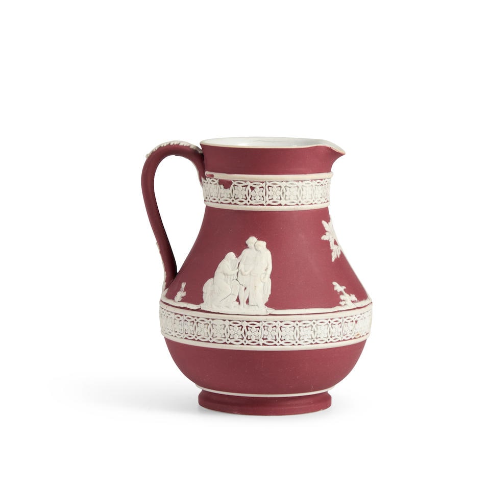 Wedgwood Crimson Jasper Dip Jug, England, early 20th century,: Wedgwood Crimson Jasper Dip Jug, England, early 20th century, applied white classical figures in relief within banded borders, impressed mark, ht. 4 1/2 in. Lot to be sold without reserve. For further