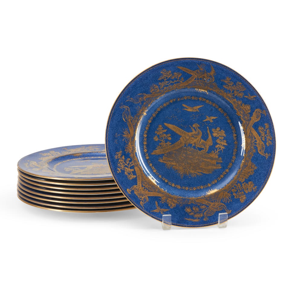 Nine Wedgwood Powder Blue Bone China Plates, England, c. 1915,: Nine Wedgwood Powder Blue Bone China Plates, England, c. 1915, each printed in gold with exotic birds, printed mark, dia. 10 1/2 in. Lot to be sold without reserve. For further information on this lot
