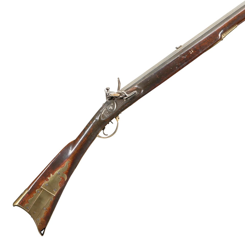 A FLINTLOCK AMERICAN LONG RIFLE,: A FLINTLOCK AMERICAN LONG RIFLE, second quarter of the 19th century. 40 3/8 in., .54 caliber octagon barrel with brass blade front sight and notch rear sight; flat lock plate with rounded tail marked 