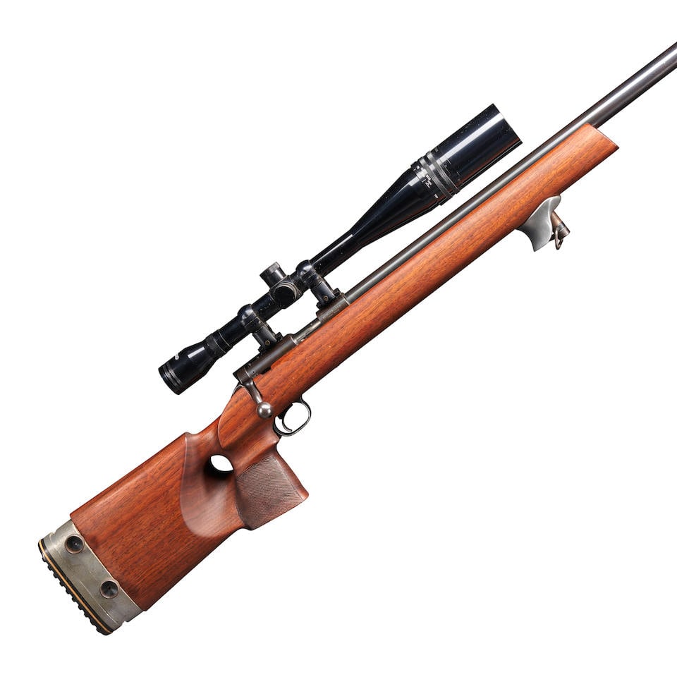 A WINCHESTER MODEL 52C TARGET RIFLE MOUNTED IN A FREESTYLE STOCK WITH ACCESSORIES,: A WINCHESTER MODEL 52C TARGET RIFLE MOUNTED IN A FREESTYLE STOCK WITH ACCESSORIES, 1960. Serial number 99418C, .22 Long Rifle caliber, blued heavy bull barrel and steel frame with proper roller engrav