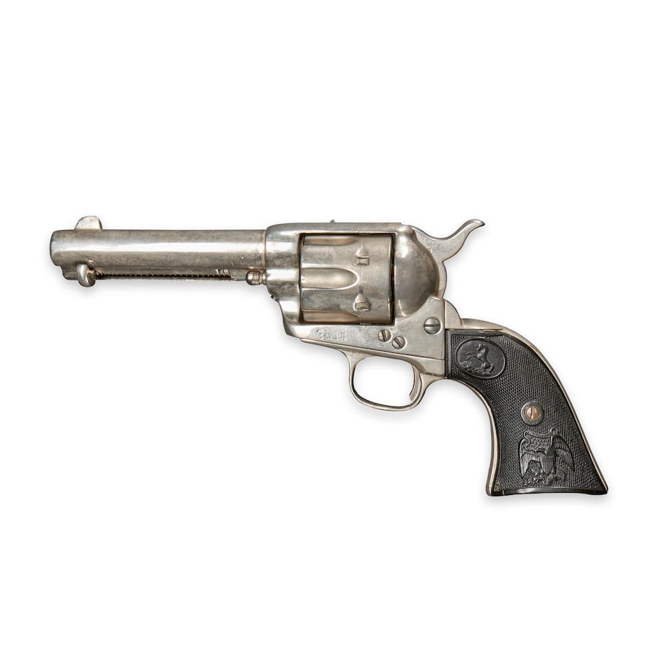 A COLT SINGLE ACTION ARMY REVOLVER,: A COLT SINGLE ACTION ARMY REVOLVER, 1888. Serial number 127825, .45 Colt caliber, re-nickel-plated, barrel markings faint, framed marked 'PAT. SEPT.19.1871/ ' JULY.2.-72/ ' JAN.19.-75', later checkere