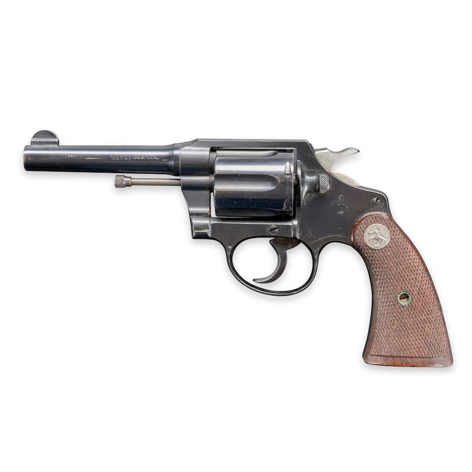 A COLT POLICE POSITIVE SPECIAL DOUBLE ACTION REVOLVER, Curio or Relic firearm: A COLT POLICE POSITIVE SPECIAL DOUBLE ACTION REVOLVER, 1932. Serial number 409759, .38 Special caliber, blued steel barrel, frame and cylinder with proper roller engraved markings, checkered walnut gr