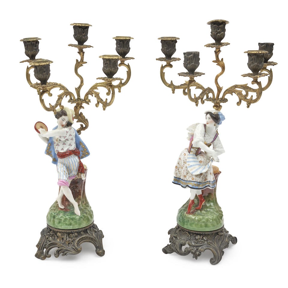 PAIR OF FRENCH PORCELAIN FIGURAL CANDELABRA 19th century,: PAIR OF FRENCH PORCELAIN FIGURAL CANDELABRA 19th century, polychrome enameled and gilded figures, gilt and patinated bronze mounts. Footnotes: OVERALL CONDITION: Fair. Damage and wear throughout. This