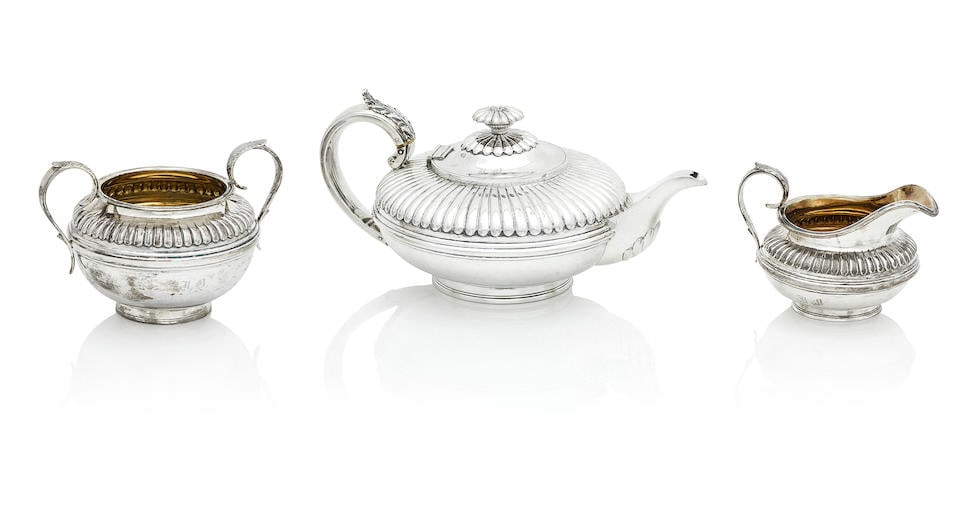 A matched Victorian three-piece tea service By Charles Thomas Fox & George Fox, London, 1841, th...: A matched Victorian three-piece tea service By Charles Thomas Fox & George Fox, London, 1841, the milk jug 1843 Each piece compressed form and lobed to the upper part, the teapot with ivory insulator