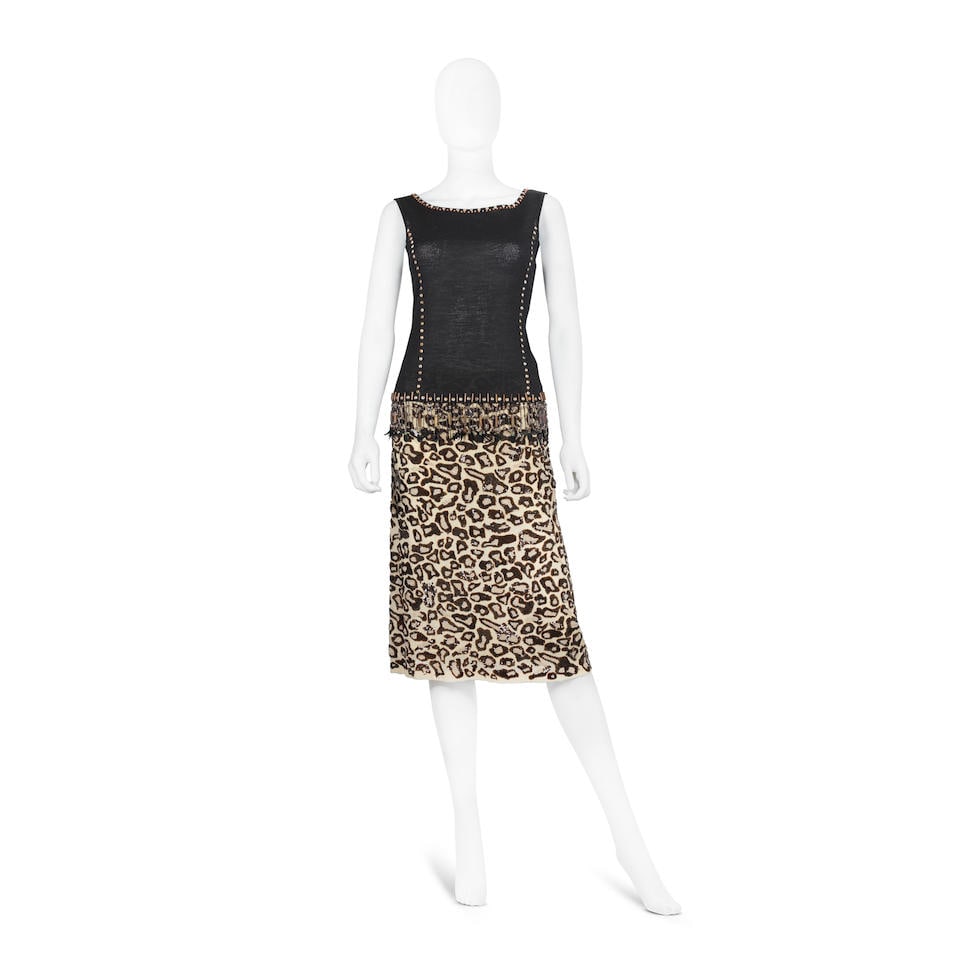 Escada: a Black Beaded Top and a Leopard Print Sequin Skirt 1990s: Escada: a Black Beaded Top and a Leopard Print Sequin Skirt 1990s Includes a black knit top, labelled size 38, and a silk skirt, labelled size 36 (2) Labelled size 38 Footnotes: CONDITION REPORT Condi