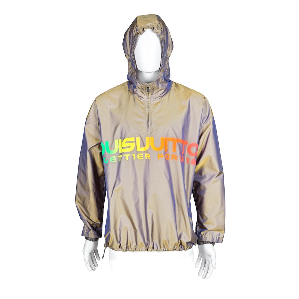 Louis Vuitton: a Men's Grey Hooded Pullover Jacket Spring/Summer 2018: Louis Vuitton: a Men's Grey Hooded Pullover Jacket Spring/Summer 2018 Creative Director: Kim Jones One-off sample piece with spelling mistake in' MALLETTIER' logo created for the Spring/Summer 2018 me