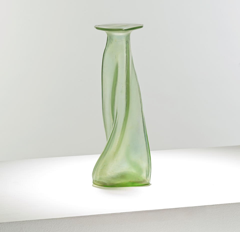 Christopher Dresser for Loetz 'Olympia' vase, circa 1896: Christopher Dresser for Loetz 'Olympia' vase, circa 1896 Matte green and clear glass, the twisted tapering body rising to a triangular rim with pinched edges. 26 cm high, 10 cm diameter Footnotes: Pro