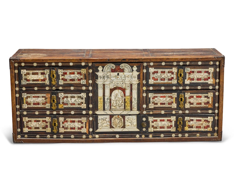 A Spanish walnut, tortoiseshell and engraved bone varguano17th century with later elements: A Spanish walnut, tortoiseshell and engraved bone varguano 17th century with later elements Lacking stand and front, with a central deep drawer enclosed by six further drawers, the engraved decoration